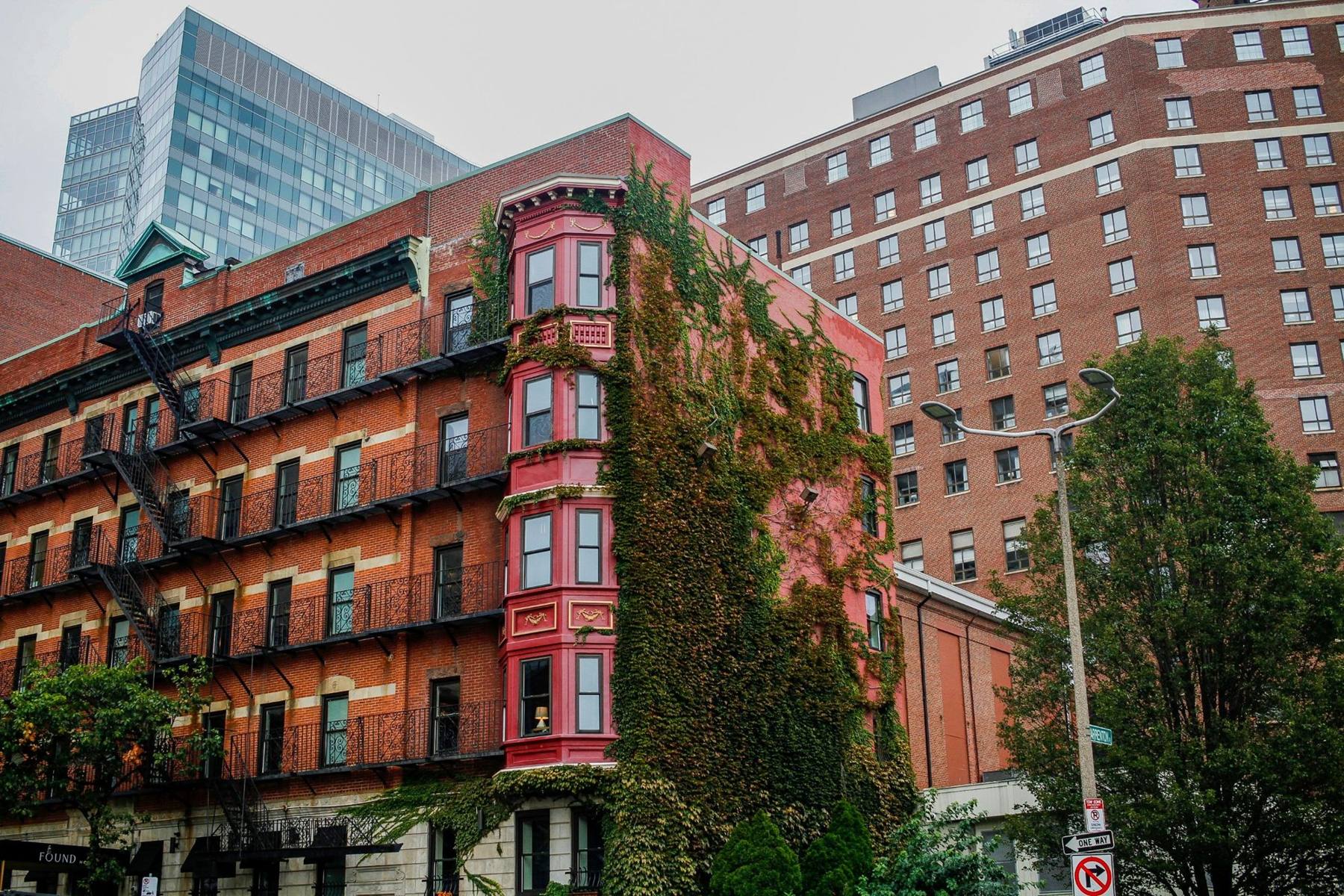 Looking up at red brick buildings against the sky